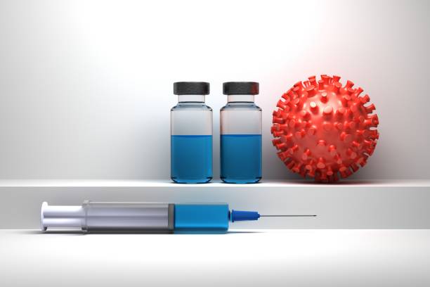 istock Syringe and bottles with vaccine and red virus particle 1217006762