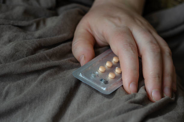 istock Blister with pills in a female hand. 1217007941