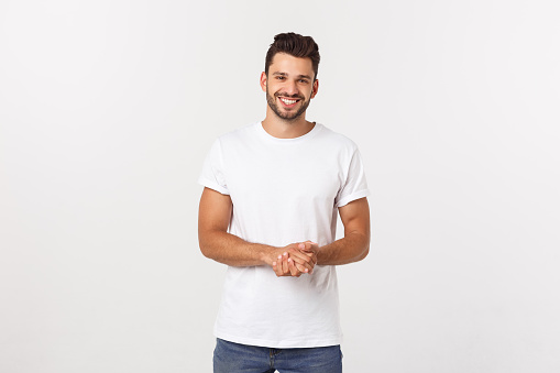 Portrait of smiling young man in a white t-shirt isolated on white background