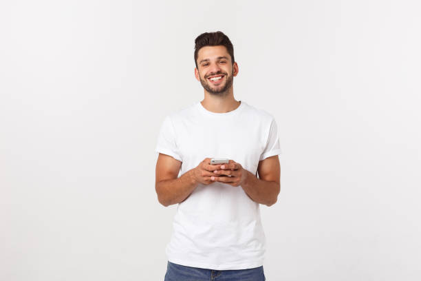 istock Charming handsome. Handsome young man in casual wear while standing isolated on white background 1217009085