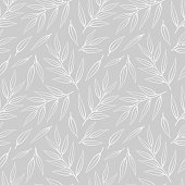 istock Vector seamless pattern with white leaves on twigs on gray background. 1217009125