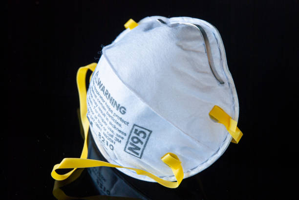 N95 face mask Personal Protective Equipment (PPE) N95 face mask n95 face mask photos stock pictures, royalty-free photos & images