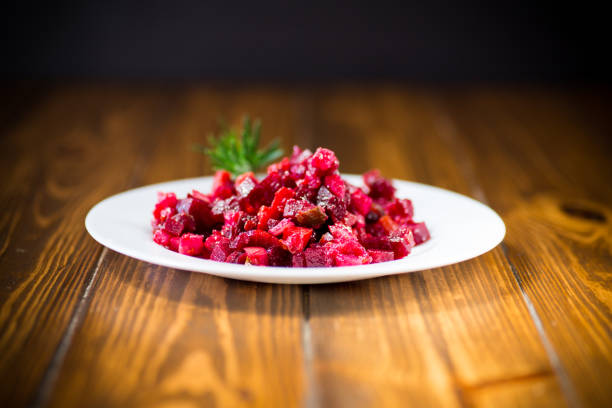 cold salad boiled vegetables salad on a wooden table