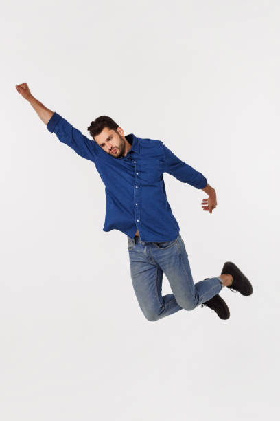 istock An attractive athletic businessman jumping up against white background 1217010839