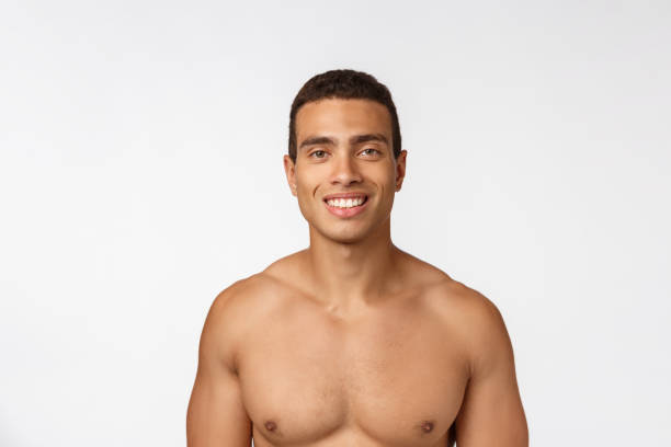 portrait of a muscular african american man with no shirt. isolated over white background. - sensuality men shirtless studio shot imagens e fotografias de stock