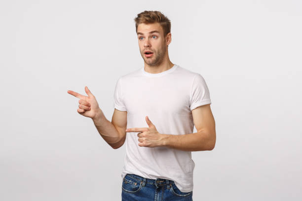 istock Stunned, handsome bearded blond guy losing speech from hot chick, open mouth, drooling on something awesome, looking pointing left astounded, standing white background amazed 1217013413