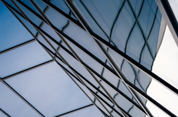 istock reflection with distortion in the window of a modern tall building 1217013431