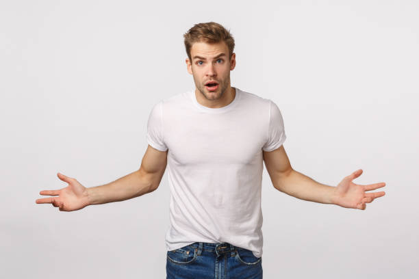 istock Aggressive and angry guy waiting explanation. Pissed blond male spread hands sideways and staring camera questioned, have arguments, look bothered and frustrated, asking what happened 1217013505