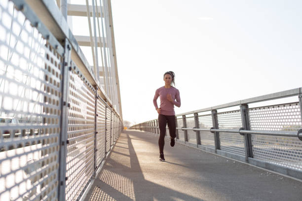 istock Female running in the city 1217015689