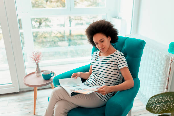 istock Woman reading a magazine 1217016092