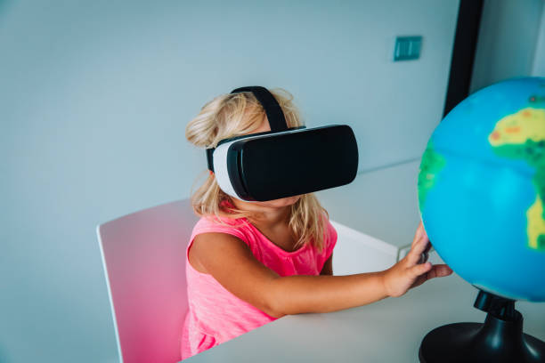 istock little girl with virtual reality googles on distant learning at home 1217016115