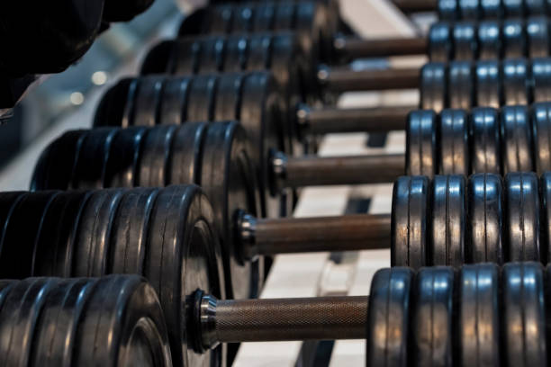 istock Close up image of chrome dumbbells in gym 1217016257