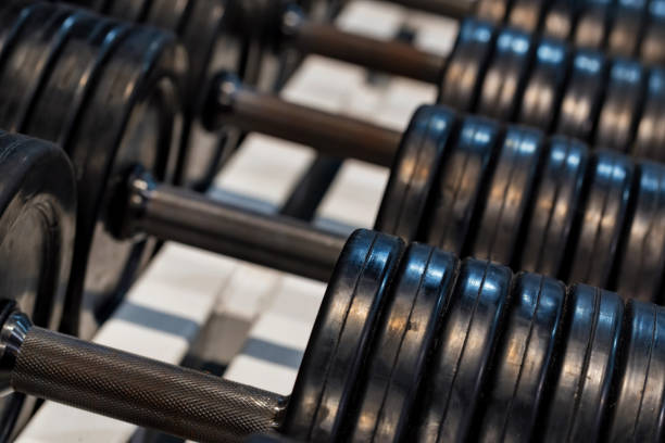 istock Close up image of chrome dumbbells in gym 1217016779
