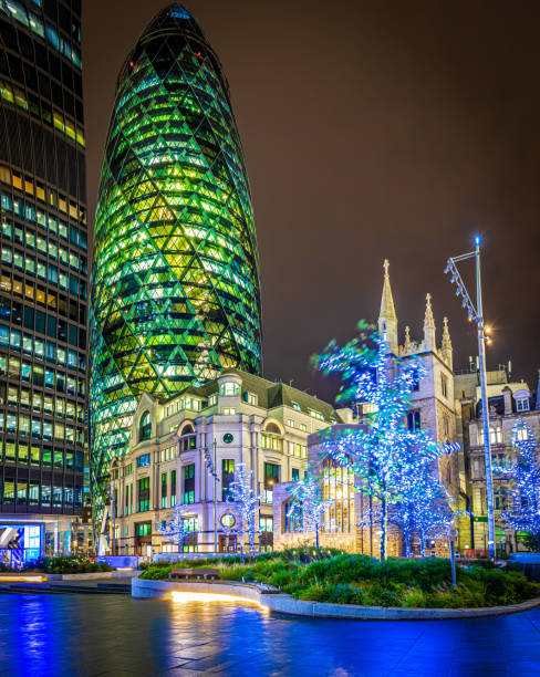 Gherkin skyscrapper in the City of London Gherkin skyscrapper in the City of London gherkin london night stock pictures, royalty-free photos & images
