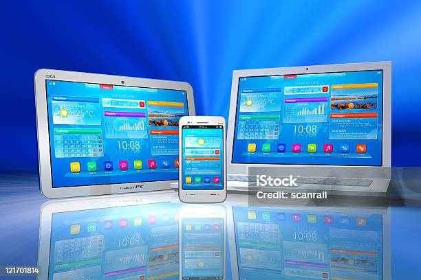A Laptop Tablet And Smartphone On A Blue Backdrop Stock Photo - Download Image Now - Blue, Blue Background, Business