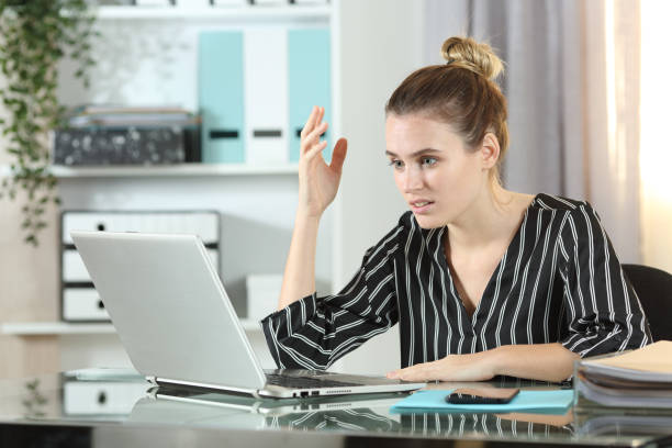 istock Frustrated entrepreneur with laptop complaining in the office 1217019906