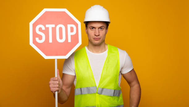istock Confident professional man in safety helmet 1217020095