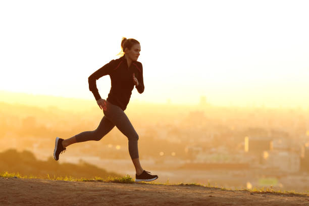 istock Jogger running at sunset in city outskirts 1217020179
