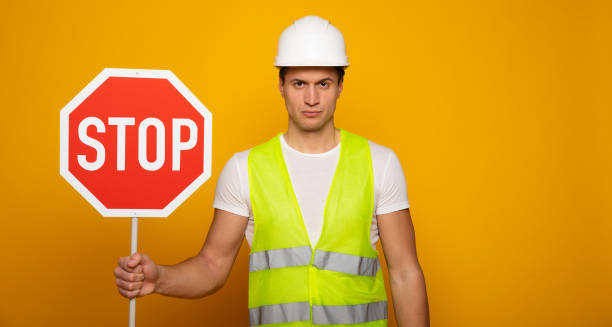 istock Confident professional man in safety helmet 1217020293
