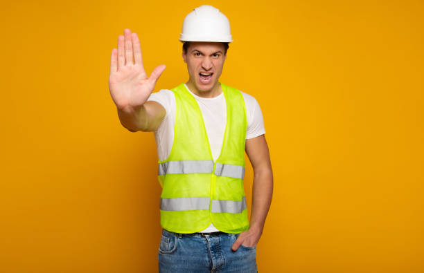 istock Confident professional man in safety helmet 1217020318