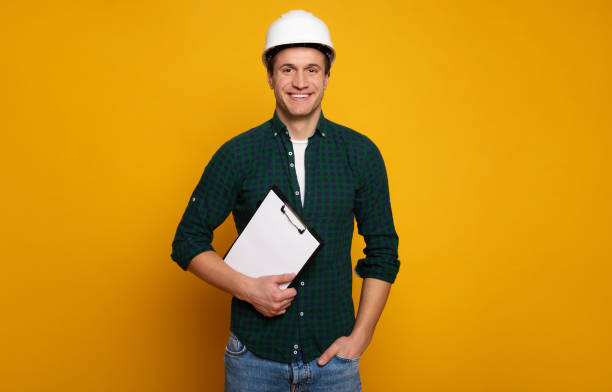 istock Confident professional man in safety helmet 1217020419
