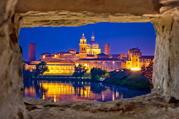 istock City of Mantova skyline evening view through stone window 1217021576