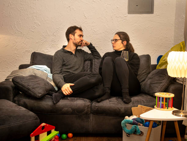 istock Parents seriously talking on the sofa in the evening 1217023140