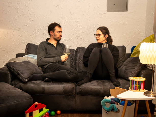 istock Parents seriously talking on the sofa in the evening 1217023141