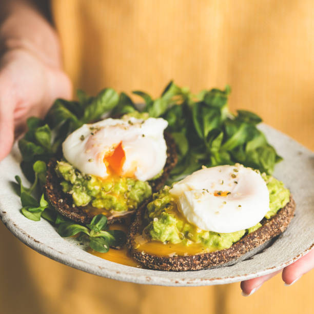 istock Poached egg and avocado on rye bread toast 1217024903