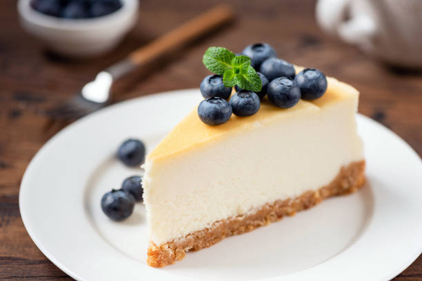 Cheesecake with blueberries on white plate
