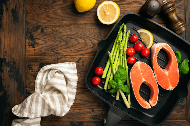 istock Uncooked salmon steaks and vegetables 1217025013