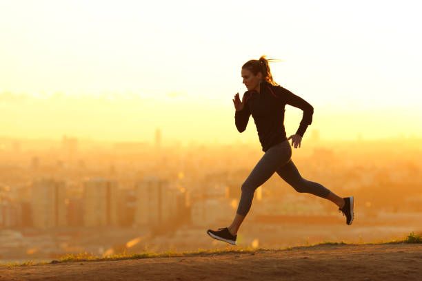 istock Jogger running in city outskirts at sunset 1217026236