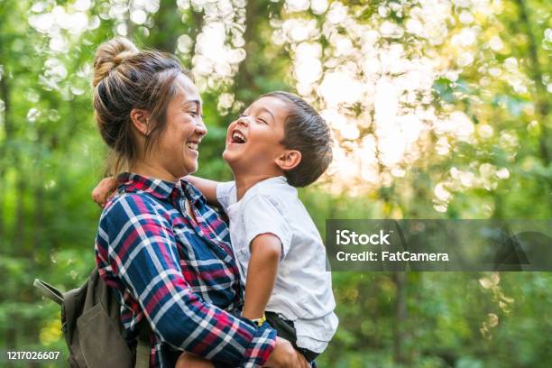 Mother And Son Enjoy Time In Nature Stock Photo Stock Photo - Download Image Now - Family, Outdoors, Multiracial Group