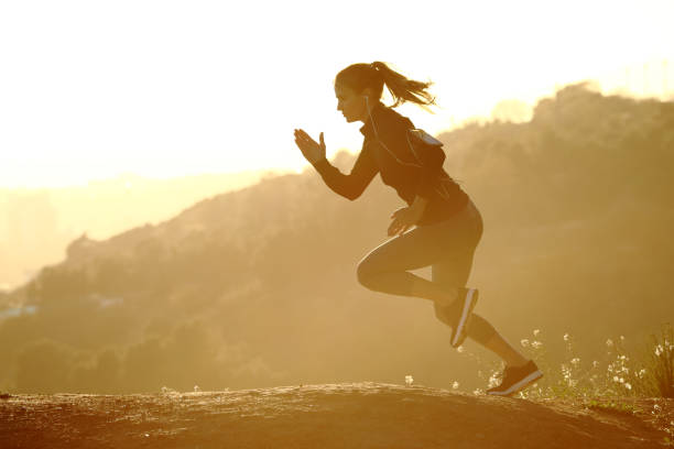 istock Runner woman running fast at sunset 1217027634
