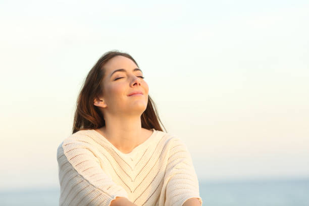 istock Relaxed woman breaths on the beach 1217028205