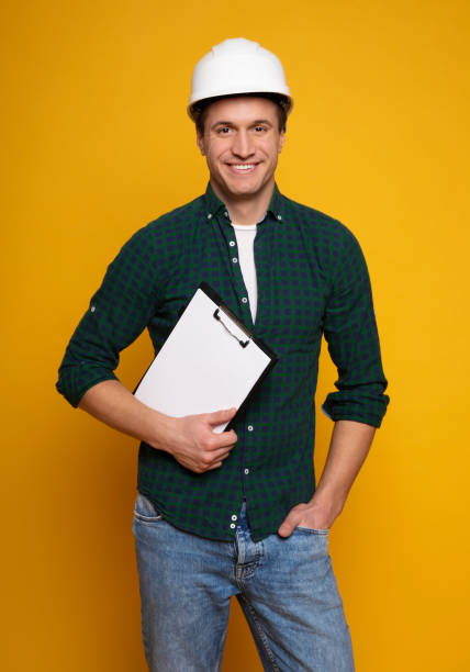 istock Confident professional man in safety helmet 1217028849