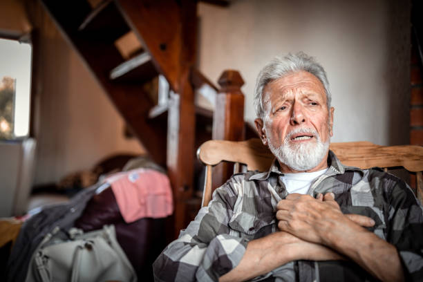 I'm sick and the hospitals are full of people.Quarantine Senior man suffering from heart attack at home male chest pain stock pictures, royalty-free photos & images