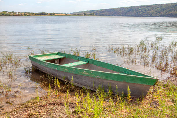 istock fishing boat on the shore 1217029086