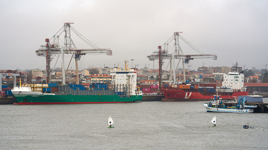 Leixoes, Portugal - February 1, 2020: Two containerships at the port of Leixoes on an overcast day on February 1, 2020 in Portugal