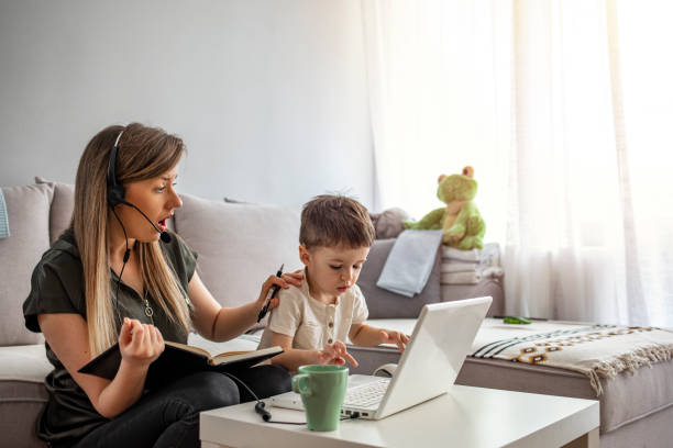 istock Mother working from home with kid. 1217032491