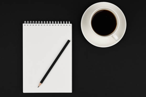 Three pencils kept in cup on white background