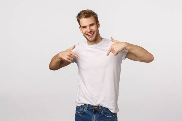 istock Charming happy smiling, outgoing blond caucasian guy want participate, pointing himself with self-assured expression, want job, suggest himself, standing joyful white background 1217033158