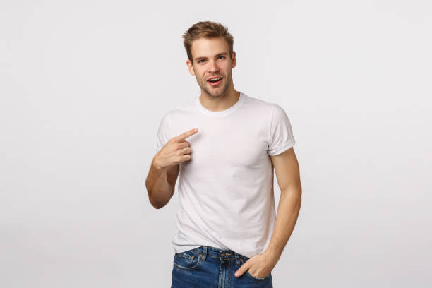 istock Are you talking about me. Questioned not sure cute handsome blond man with bristle, looking surprised pointing himself, making sure he heard right, being chosen, standing white background 1217033164