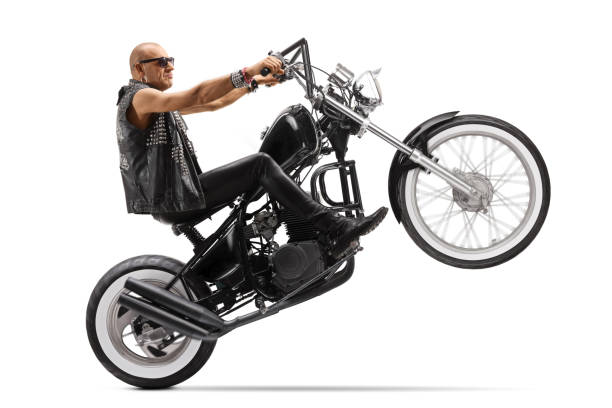 istock Biker riding a chopper on one wheel 1217033872