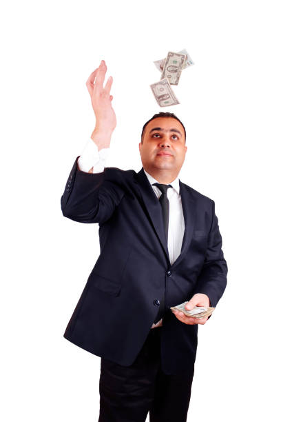 istock Businessman in formal wear throws up paper money. Isolate 1217035593
