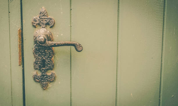 istock Vintage door handle on wooden door 1217037556