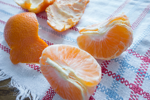 Close up peeling scene of Organic tangerine