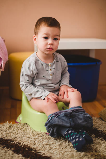 istock Child sitting on the potty 1217039070