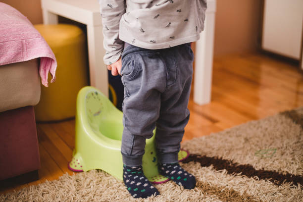Child preparing to  sit on the potty