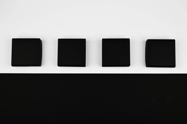 istock black boxes on a white background. black boxes on a blue background on a flat lay 1217041408